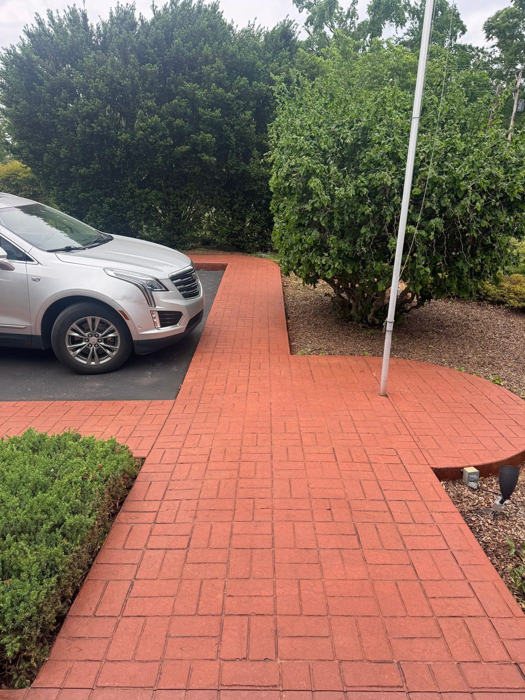 Stamped brick-pattern walkway and curbing in Brentwood, cleaned, sealed, and color-refreshed