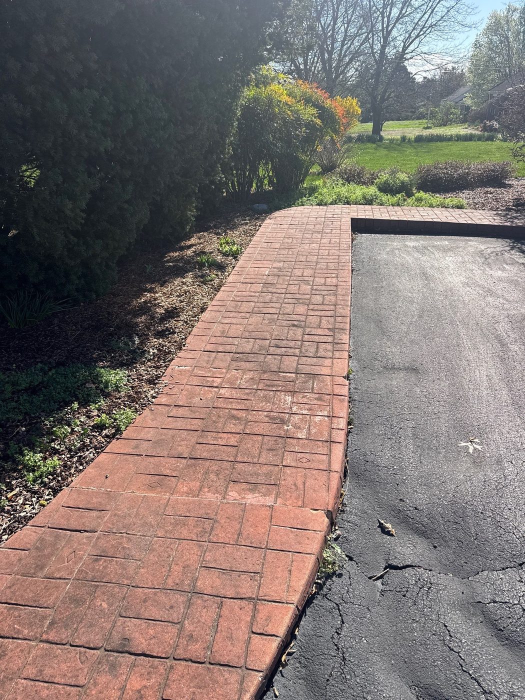 Same Brentwood stamped walkway before cleaning and sealing, faded and dull
