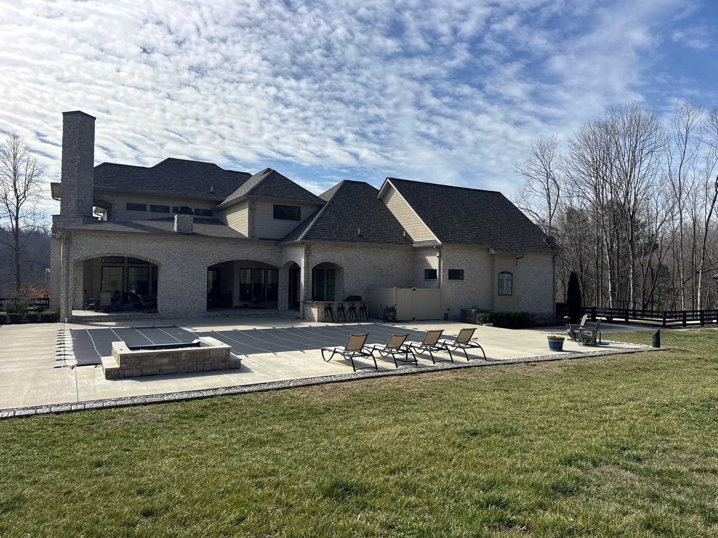 Worn pool deck in Hendersonville before architectural quartz resurfacing