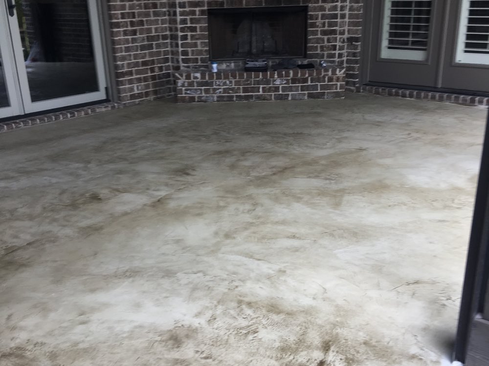Color worked into the porch slab in Thompson's Station, mottled and still matte before sealing