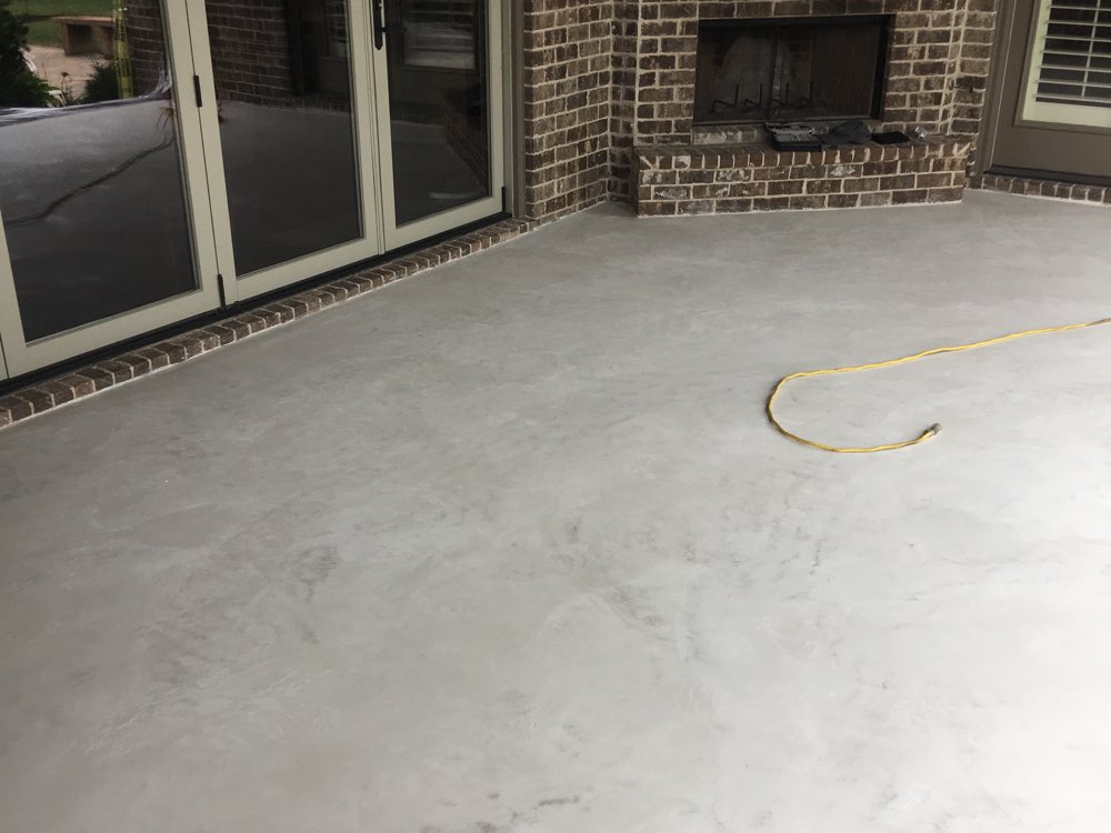 The same Thompson's Station porch from the same spot earlier that morning, a flat gray slab