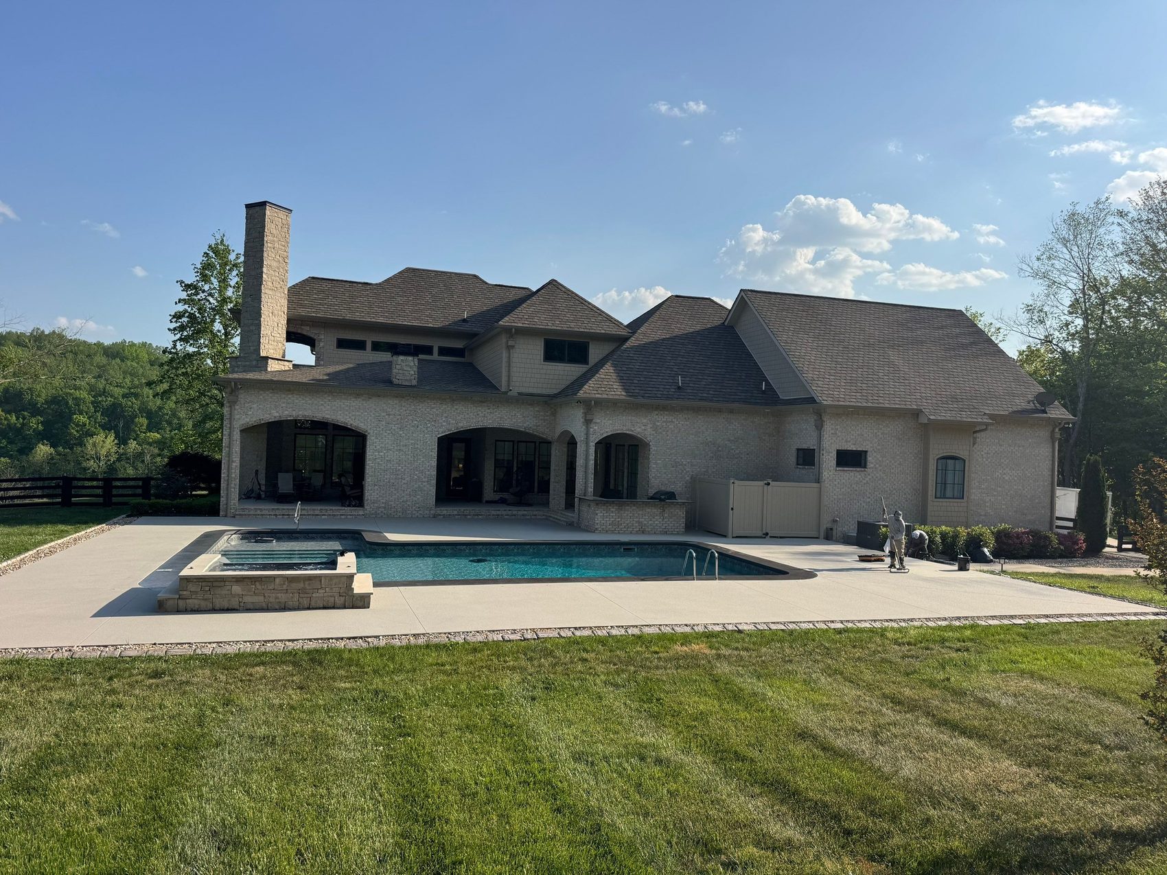 Estate pool deck and spa coping resurfaced in a durable architectural quartz finish in Hendersonville